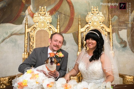 Bridal Couple on thrones in theatre ceremony room Craig y Nos Castle