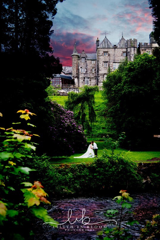 Bridal Couple in Lower Gardens at Craig y Nos Castle viewd from across the river Ceremony Only Weddings Venue South Wales Craig y Nos Castle
