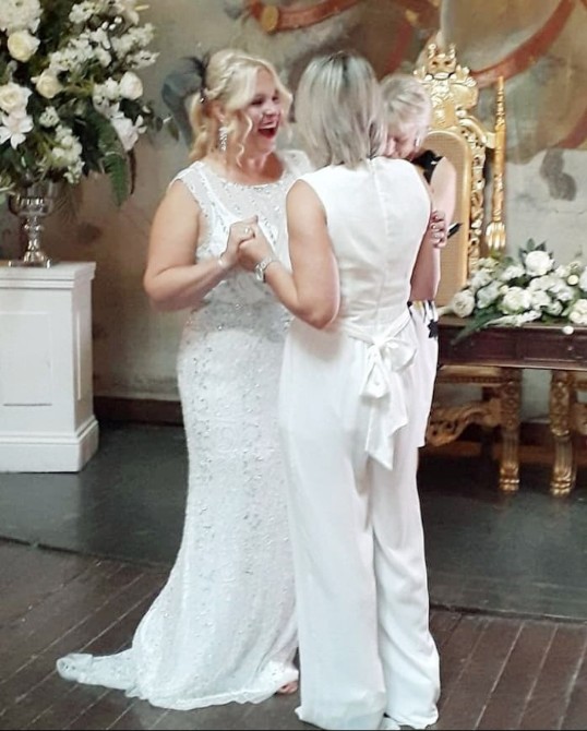 Bride and Bride marrying in Opera House at Craig y Nos Castle