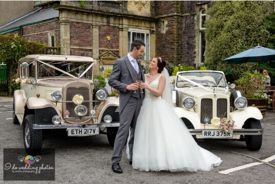 Cream vintage cars  in Courtyard at Craig y Nos Castle