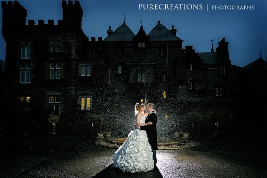 Wedding Venue Wales Bride and Groom in front of Craig y Nos Castle at night WWedding Venue Wales Bride and Groom in front of Craig y Nos Castle at night