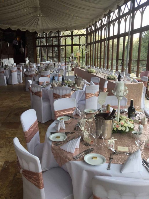 Conservatory Wedding Rececption Gold copper table decor Copper colour table decor and chair covers Craig y Nos Wedding Reception