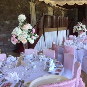 Pink and white flowers and chaircovers pink and white wedding decor chair covers and flowers