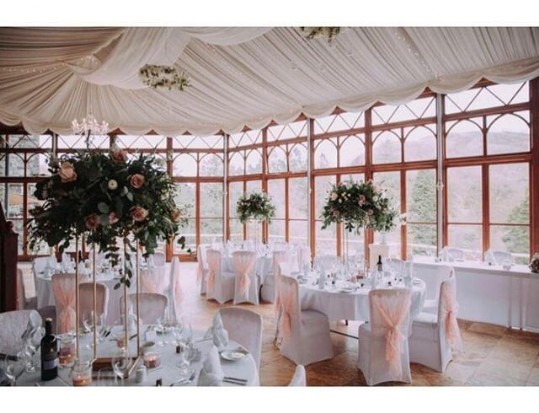 Craig y Nos Castle Wedding Venue Swansea Conservatory with light purple chair covers