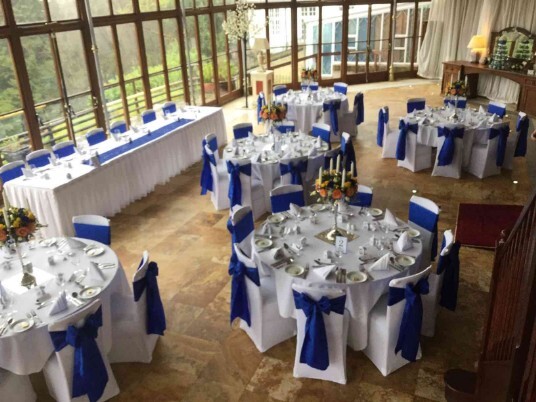 Marriage Venue Wales Craig y Nos Castle Conservatory blue sashes