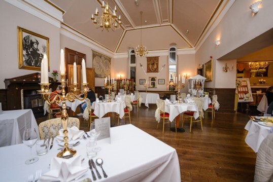Craig y Nos Castle Wedding Venue in Swansea showing Conservatory Wedding Breakfast with white linen