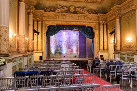 Theatre shown with full stage open and original backdrop curtain