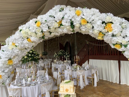 Craig y Nos Castle Wedding Venue Swansea Conservatory Wedding Breakfast pale yellow ribboned chair covers