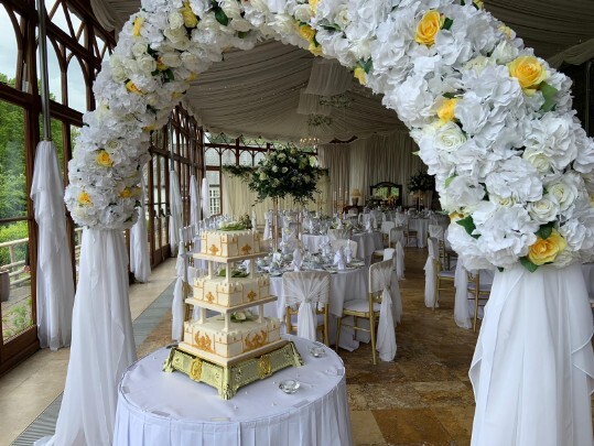 Craig y Nos Castle Wedding Venue Swansea Conservatory Wedding Breakfast pale yellow ribboned chair covers