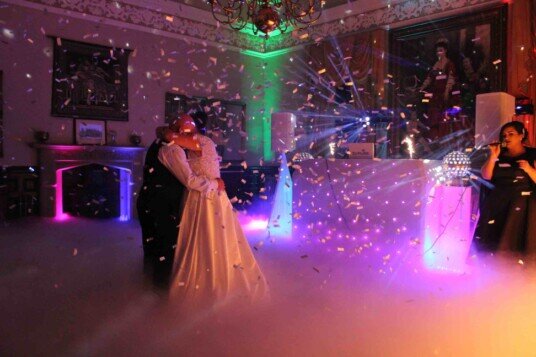 Beautiful dancing on clouds with bridal dress lit fromm underfloor lighting Evening Wedding Package South Wales Wedding Venue
