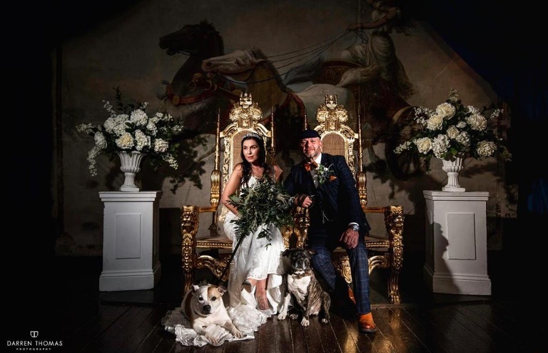 Bridal Couple on thrones in theatre ceremony room Craig y Nos Castle