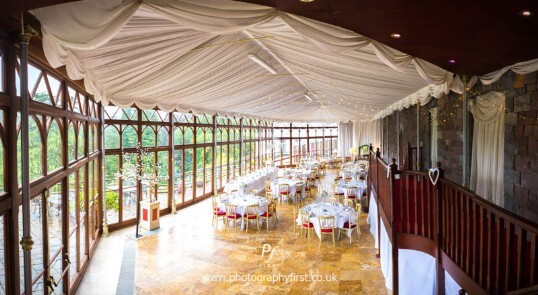 Craig y Nos Castle Wedding Venue in Swansea showing Conservatory Wedding Breakfast with white linen