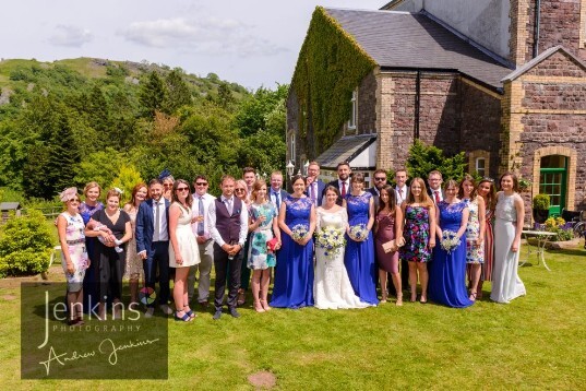 All in blue in theatre gardens at Craig y Nos Castle Wales Wedding Venue
