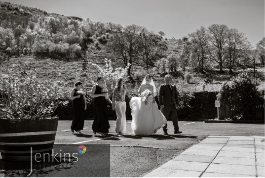 Craig y Nos Castle Bride approaches Ceremony Room from Courtyard