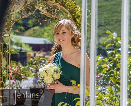 Craig y Nos Castle Bridesmaid approaches Ceremony Room from Courtyard