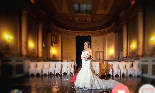 Bride on stage in Ceremony room at Craig y Nos Castle weddings