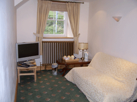 Craig y Nos Castle En-Suite Room AB15 lounge with sofa bed that can sleep an extra two Wedding Venues South Wales - Craig y Nos Castle Accommodation Room AB15 lounge