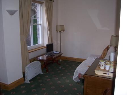 Craig y Nos Castle Accommodation Room AB16 lounge with sofa bed (hidden on right) Wedding Venues South Wales - Craig y Nos Castle Accommodation Room AB16 lounge with sofa bed