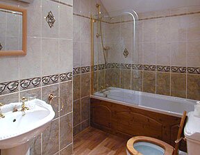 Craig y Nos Castle Room AB26 bathroom (wooden floor due to be replaced with a tiled floor soon) Wedding Venues South Wales - Craig y Nos Castle Accommodation Room AB26 bathroom
