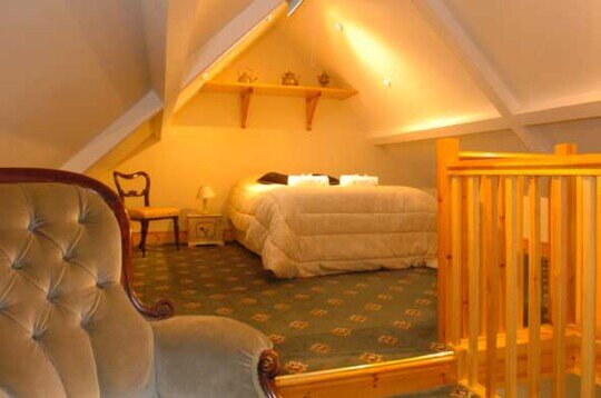 Craig y Nos Castle Accommodation Room AB31 double bed in loft section Craig y Nos Castle Duplex bedroom