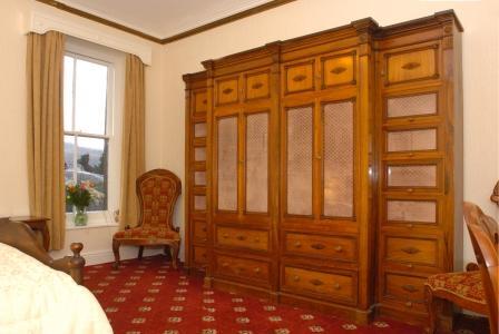 Craig y Nos Castle Accommodation Room 35 large combination rosewood wardrobe and chest of drawers Wedding Venues South Wales - Craig y Nos Castle Accommodation Room 35