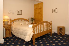 Craig y Nos Castle AB36 double room with pine furniture Craig y Nos Castle pine double bed in AB36 en-suite