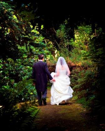 Bride and Groom walking in Craig y Nos Country Park Bride and Groom walking in Craig y Nos Country Park
