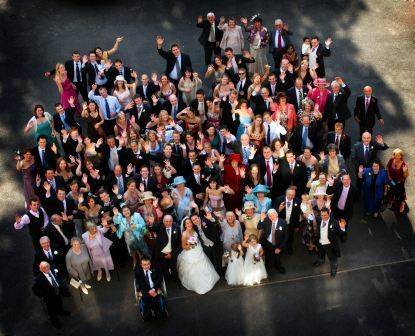 By Ann Clark Photography - Wedding Party gather in Courtyard at Craig y Nos Castle Wedding Guests in Courtyard at Craig y Nos Castle Wedddings in Wales