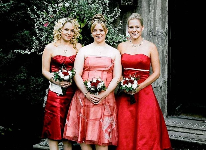 Red Bridesmaids outside the front door at Craig y Nos Castle Wedding Planner Book, Bridesmaids in pink and red at Craig y Nos Castle South Wales