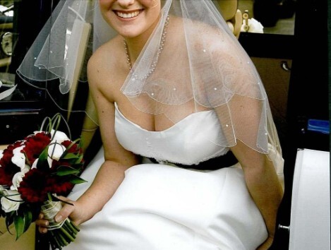 Wedding Planner Book, Bride in white holding Wedding Planner Book, Bride in white holding red and white flowers bouquet