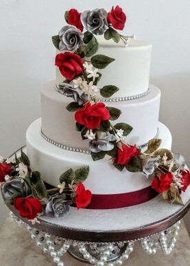 Red Roses Wedding Cake Craig y Nos Castle Wedding Cake with red roses design Craig y Nos Castle