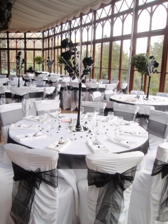 Wedding Tips, Conservatory Black and White Chair covers and Tables South Wales Wedding Venue Craig y Nos Castle Conservatory Black and White Chair covers and Tables