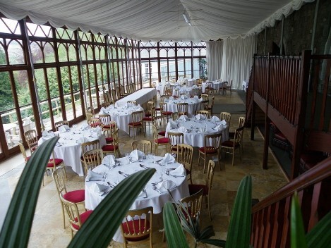 Craig y Nos Castle Wedding Venue in Swansea showing Conservatory Wedding Breakfast with white linen