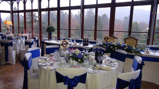 London Tube staion themed wedding with London Underground signs in white and blue matching the white and blue wedding theme