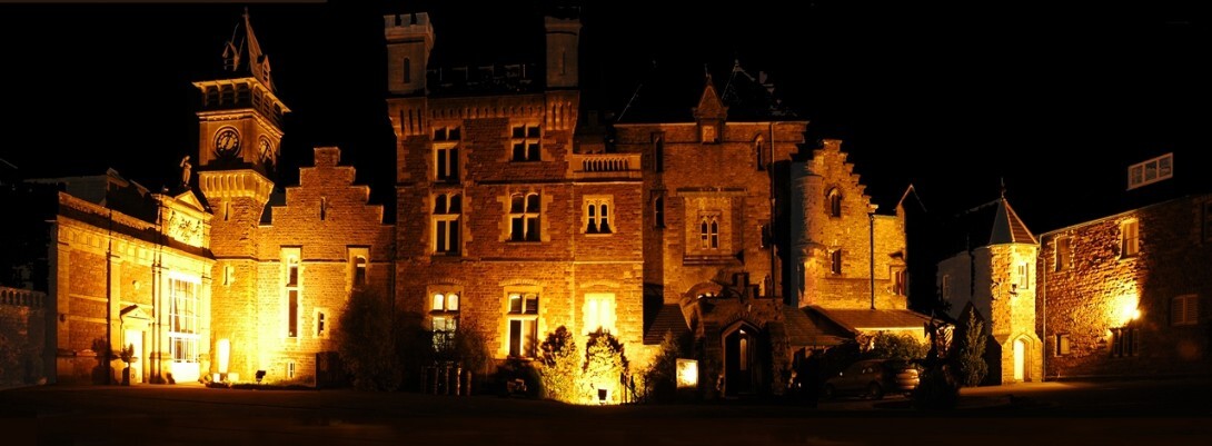 This is the original 2004 Photo of Craig y Nos Castle fully floodlit at night by three powerful floods Craig y Nos Castle Wedding Venue in South Wales Floodlit at Night