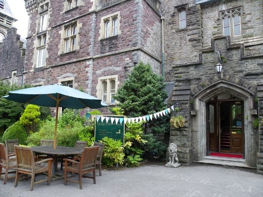Front entrance of Craig y Nos Castle, note the new red mat in the entrance (but it soon faded to a dull brown colour) Craig y Nos Castle Wedding Venue Swansea Front Entrance and Porch