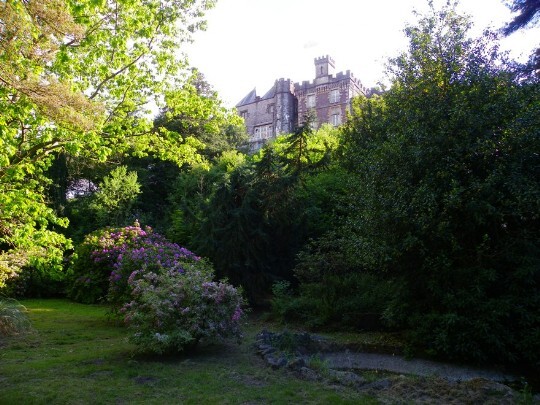 Lower gardens by the ponds, looking back up at the rear of Craig y Nos Castle Craig y Nos Castle Wedding Venue South Wales Lower Gardens