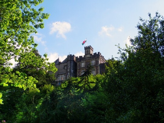 Flag flying atop Craig y Nos Castle, as seen from the lower gardens, in summer Craig y Nos Castle overlooking as seen from lower gardens