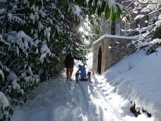 Craig y Nos Castle snow on upper terrace path, boy on segway