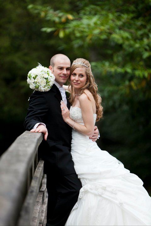 Craig y Nos Castle Wedding Venue in South wales couple on bridge over river Tawe in Country Park