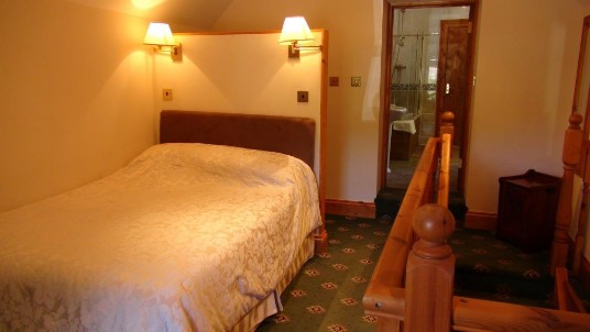 Master Bedroom in Gatehouse at Craig y Nos Castle's Gatehouse - note bathroom through door on right Master Bedroom in Gatehouse at Craig y Nos Castle Wedding Venue in Wales