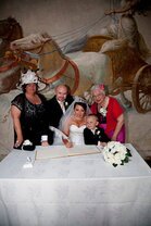 Kevin John Wedding Photography Bridal Couple signing the register in the wedding ceremony room at Craig y Nos Castle South Wales