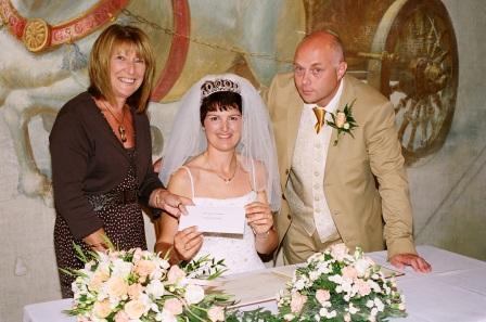 Weddings in Wales Bride and Groom signing the wedding registry book by Patrick Ellis Photography