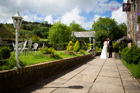 Photography First Wedding Photography Couple in theatre gardens at Craig y Nos Castle in South Wales