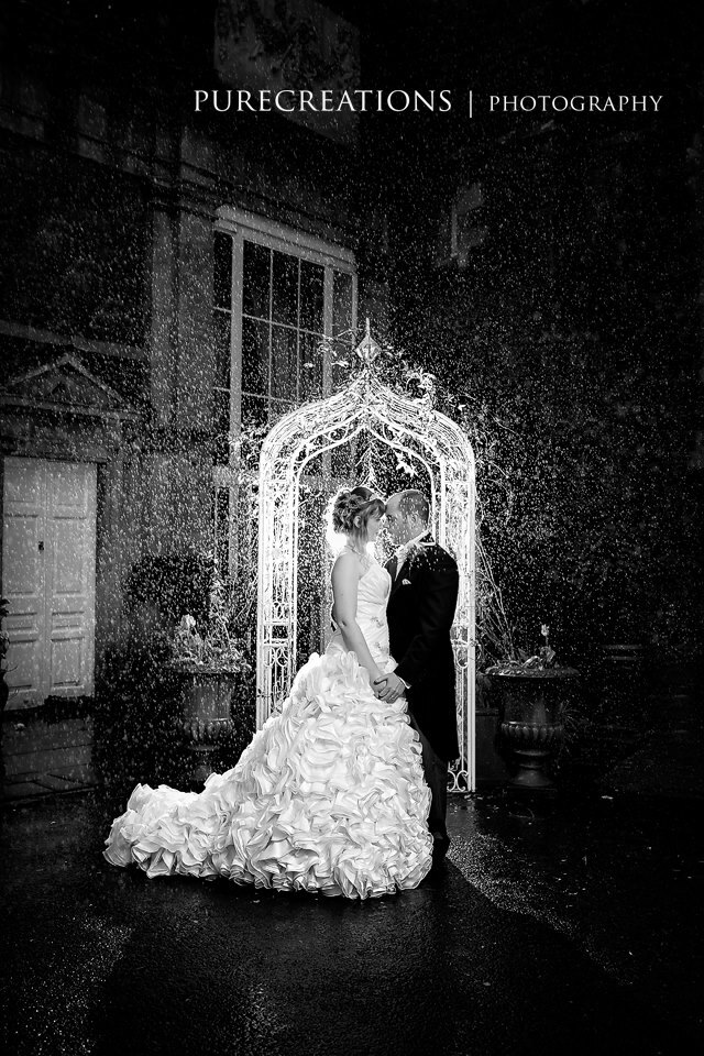 Craig y Nos Castle Wedding Venue outside Theatre Entrance showing white metal arch with bridal couple