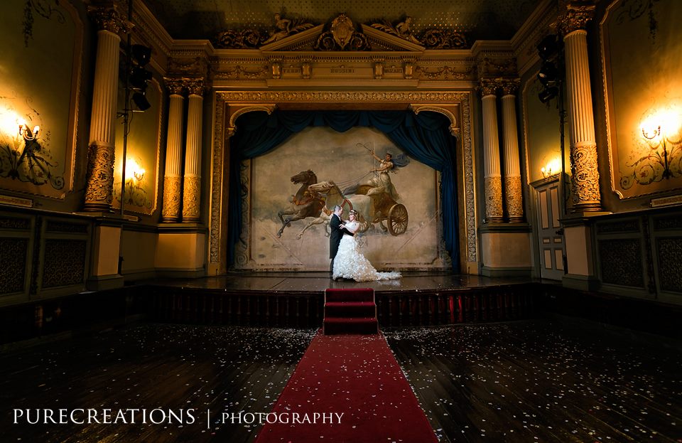 Bridal Couple on Stage at Craig y Nos Castle's Wedding Ceremony Room Weddings at Craig y Nos Castle South Wales Wedding Venue