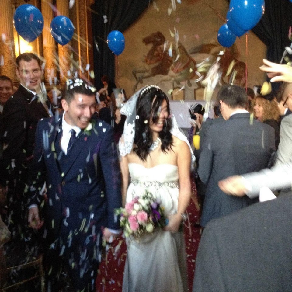 Bride and Groom leaving the theatre at Craig y Nos Castle after a wedding ceremony