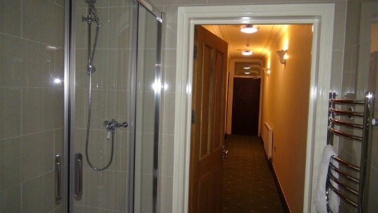 Corridor of theatre first floor flat as seen from the bathroom looking towards entrance door Wedding Venues Wales - Theatre First Floor Flat Corridor