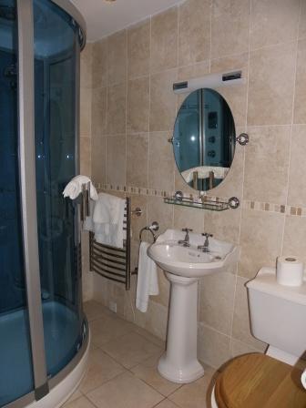 Craig y Nos Castle Theatre Ground Floor Right en-suite shower room with rather fancy shower Wedding Venues South Wales - Craig y Nos Castle small shower en-suite