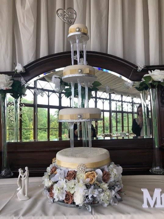 tall pillared four tier wedding cake craig y nos castle
